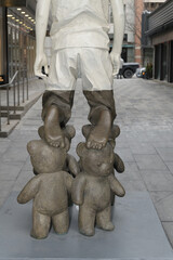 Naklejka premium detail of Willy Verginer’s Il Gioco Infinito (2021) — a bronze and acrylic sculpture exhibited at Galerie LeRoyer and Yorkville Lane in Toronto - back with big feet