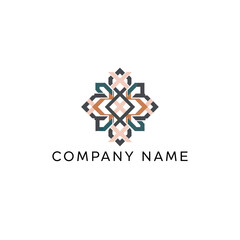 Symmetrical ornamental geometric logo with intricate floral elements.