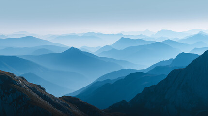 Obraz premium Blue Layered Mountain Ridges in Morning Mist