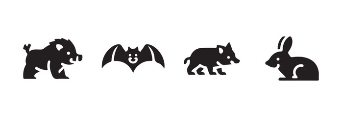 Obraz premium Collection of woodland animals in simple flat black icon style including boar, bat, small boar, and rabbit