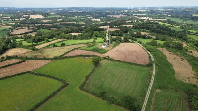 Flight over the Breton countryside with its rolling hills, ending at a telecommunications tower - Vol au dessus de la campagne bretonne en bocage avec final sur un pyl&ocirc;ne t&eacute;l&eacute;com
