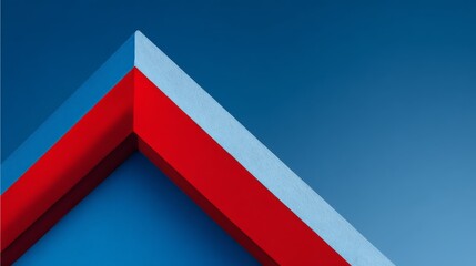 a close up of a red triangular shape with a white interior edge, reminiscent of a modern architectural sign or logo, set against a contrasting dark blue background