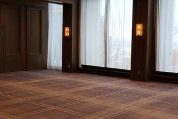 Empty room in an hotel with wooden door. Reception room for event and meeting. Business and meeting and travel.