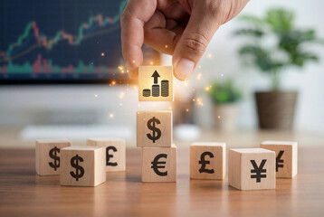 Global currency investment concept showing financial growth and forex trading strategy with wooden cubes.