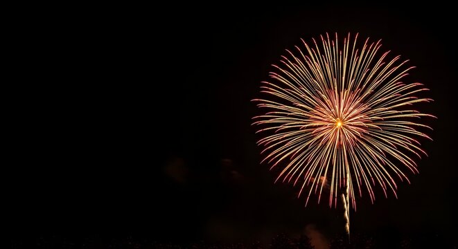 Vibrant golden fireworks exploding in a dark night sky with ample copy space for an Old New Year celebration concept and festive traditions - Powered by Adobe