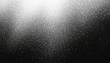 Obraz premium Close-up of water droplets densely scattered on a black surface with a gradient light reflection creating a sparkling, textured effect