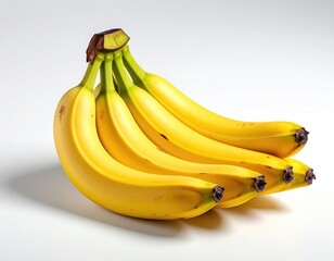 Bunch of ripe yellow bananas on a white surface