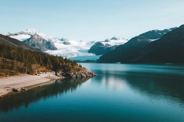 A serene alpine lake surrounded by snow-capped mountains and dense forests under a clear blue sky