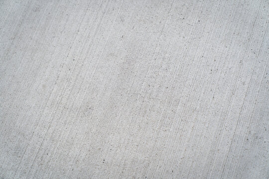 Close up concrete with brushed finish diagonal lines backdrop