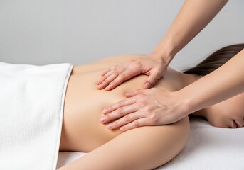 Fototapeta premium Close-up of Female Hands Performing Relaxing Back Massage on Woman at Spa Salon