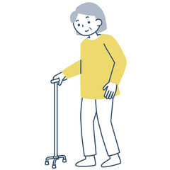 四点杖を使って歩くシニア女性