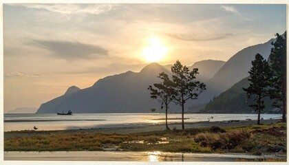 Sunset over mountain-lined coastline