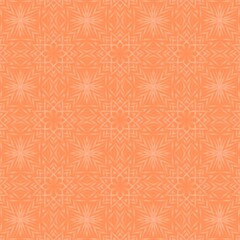 The image features an orange kaleidoscope seamless pattern, an abstract symmetrical design that resembles a flower or a starburst created by the reflection and rotation of basic shapes. 
