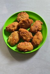 Fried grated cassava named combro in a plate 
