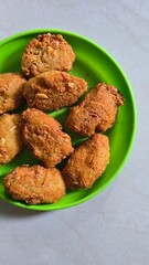 Fried grated cassava named combro in Bahasa