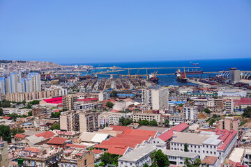 Alger the capital city of Algeria, North Africa, city centre of Algiers, the capital of Algeria, Landscape of Algiers city With port and mediterranean sea and white buildings, Arab Maghreb Africa.