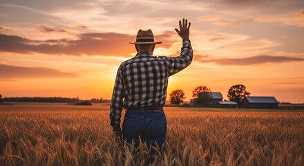 Farmer waving in a wheat field at sunset, rural scene.