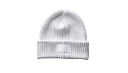 A ribbed knit white beanie hat with a small rectangular label on the brim isolated on a bright white surface clean white background cutout