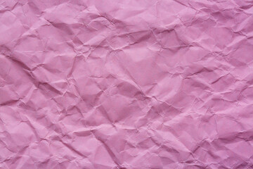 Fototapeta premium Close-up macro of crumpled pink paper texture,Background of purple with a texture of paper, which was crumpled and aged. The fashionable color of the season is Spring Crocus.