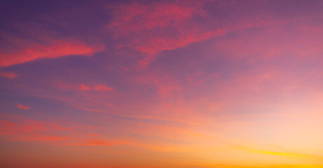 Colorful clouds and sky backdrop during twilight,sky and clouds during sunset time background,Twilight sky with crescent moon, soft pink clouds, and gradient colors during peaceful sunset.