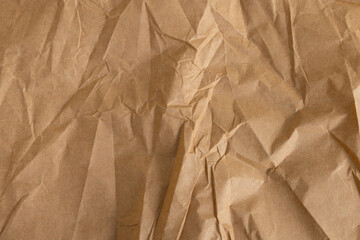 Crumpled brown paper texture,Close-up view of crumpled brown paper. Abstract pattern of crumpled...