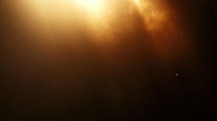 Golden light beams shining through particles in a dark space creating a warm glowing atmosphere