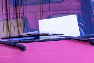 Pink public transportation tuk tuk car taxi sign Phuket Thailand.