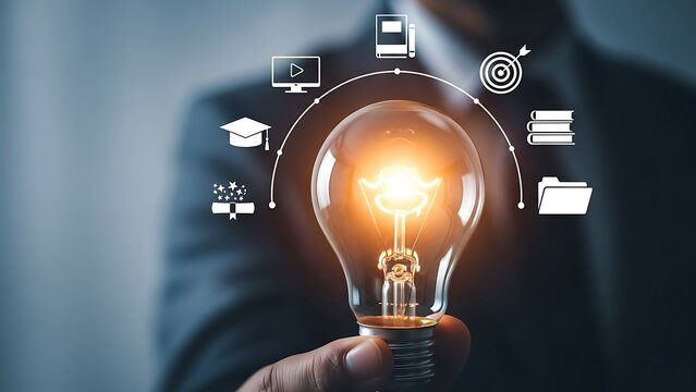 A person in a suit holds a glowing light bulb with digital icons surrounding it, symbolizing innovation and creativity in a professional setting.