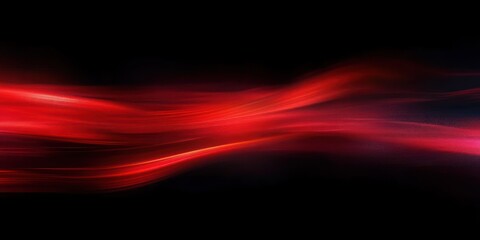 abstract flowing red light waves on a black background creating dynamic movement and energy