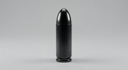 Obraz premium Metallic Bullet Isolated: A sleek, metallic bullet stands alone, symbolizing power, precision, and potential danger.