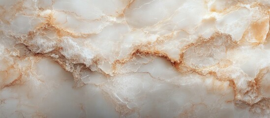 Close-up view of a smooth marble surface with cloudy white and beige hues and natural intricate brown vein patterns
