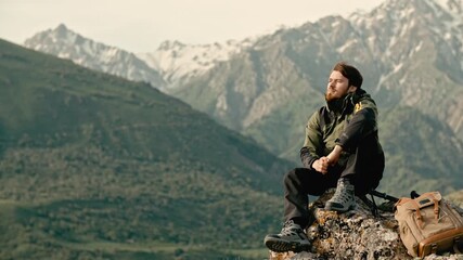 Young man traveler sitting on mountain peak enjoying freedom and fresh air concept of happy life success mindfulness relaxation travel adventure and inner peace harmony with nature outdoor lifestyle - Powered by Adobe