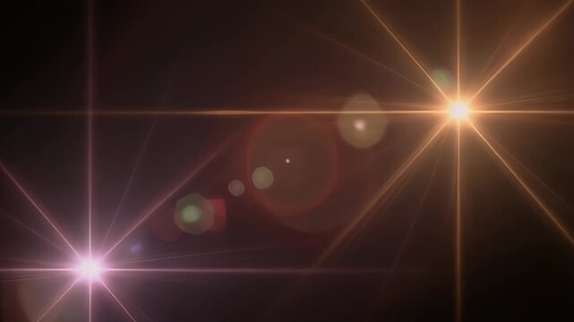 Glowing lens flare with refracted light bursts on dark backdrop