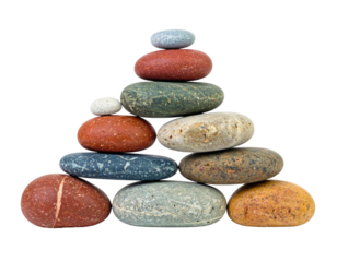 A balanced pyramid of smooth, colorful stones, isolated against a solid black background