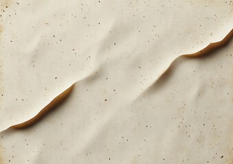 Close-up of off-white textured paper with small brown flecks and a slightly torn, curled edge creating soft shadows and gentle contours