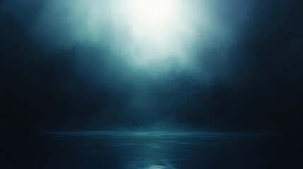 Misty dark atmosphere over calm water surface illuminated by diffuse bright light breaking through thick fog