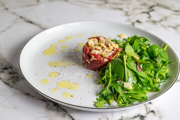Beef Carpaccio cold appetizer with parmesan