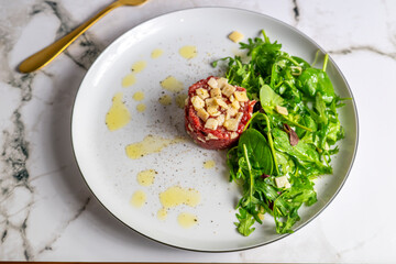 Beef Carpaccio cold appetizer with parmesan
