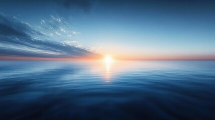 Calm ocean scene during sunrise with soft waves and blue sky merging with warm sunlight on the horizon, peaceful and serene atmosphere