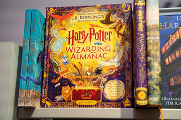 Naklejka premium Close up of Harry Potter Wizarding Almanac book on store shelf. Toronto, Canada - December 3, 2025.
