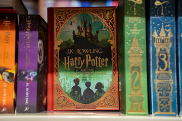 Obraz premium Close up of Harry Potter and the Philosopher's Stone illustrated edition. Toronto, Canada - December 3, 2025.