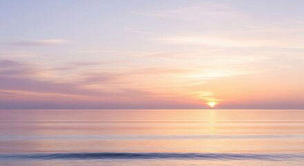 Tranquil ocean horizon reflects soft pastel hues during a quiet sunrise