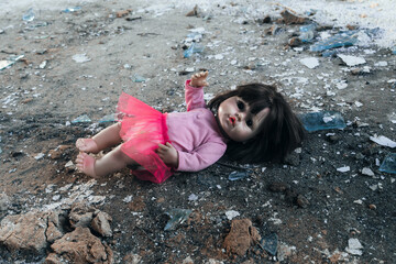 A doll lies abandoned in the rubble of a destroyed kindergarten, a stark symbol of the horrors of war, the terror inflicted on children, and civilian suffering in modern conflicts
