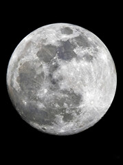 Fototapeta premium A close-up photograph of the full moon's surface, detailed with craters and texture, glowing brightly against a completely black night sky
