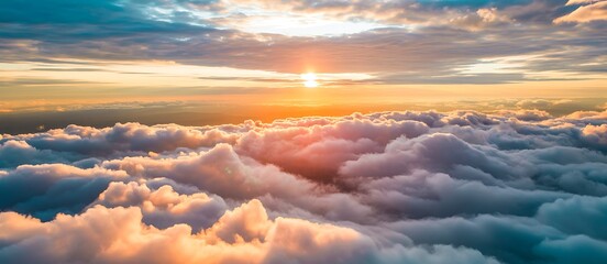 Golden hour above fluffy clouds at sunset