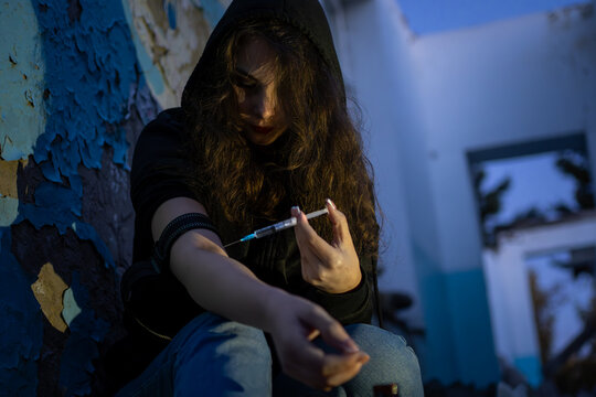 Description: A young woman suffering from heroin overdose, depicting the severe consequences and tragedy of drug addiction in a gritty, realistic style for anti-drug campaigns.
