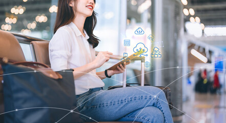 Business woman using cloud storage transferring file data network connection working everywhere at airport terminal