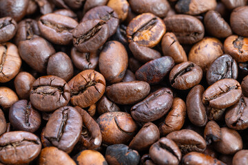 Premium coffee details, Detailed single origin coffee texture, Rich textured beans with tonal diversity, Single origin coffee beans showcasing fissures and color variation