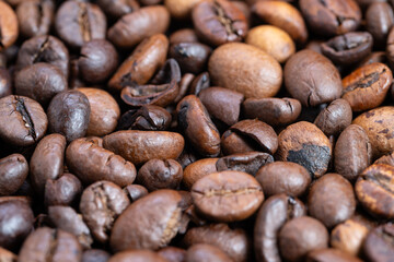 Intimate view of flavored coffee beans with warm rustic lighting, Magnified image capturing fragrant roasted coffee beans with star anise and varied shades of roasting