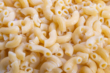 Neutralcolored uncooked macaroni suitable for branding visuals, Minimalist image featuring uncooked macaroni to enhance product packaging visuals and marketing design